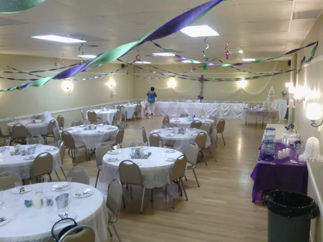 The Council Room set with round tables and streamers for a party