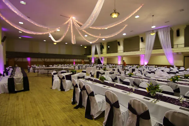 Reception tables with draped fabric along the walls