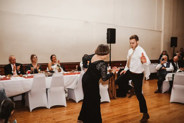 Guests dancing together on the open maple floor