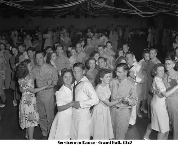 Black and white photograph captioned Servicemen Dance, Grand Hall, 1942, showing couples dancing